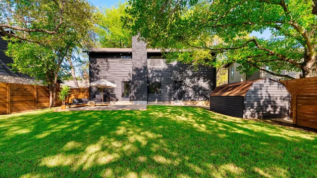 a view of a house with a yard porch and sitting area