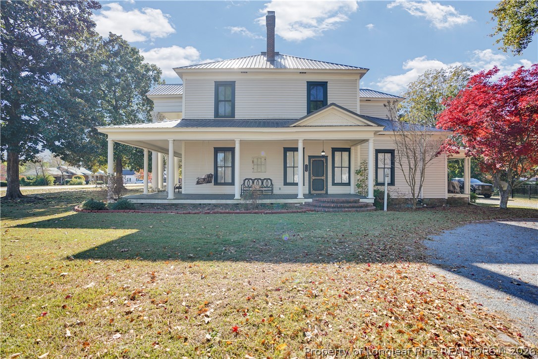 115 North Magnolia Street Raeford, NC 28376 - Photo 1 of 29 a front view of a house with a yard