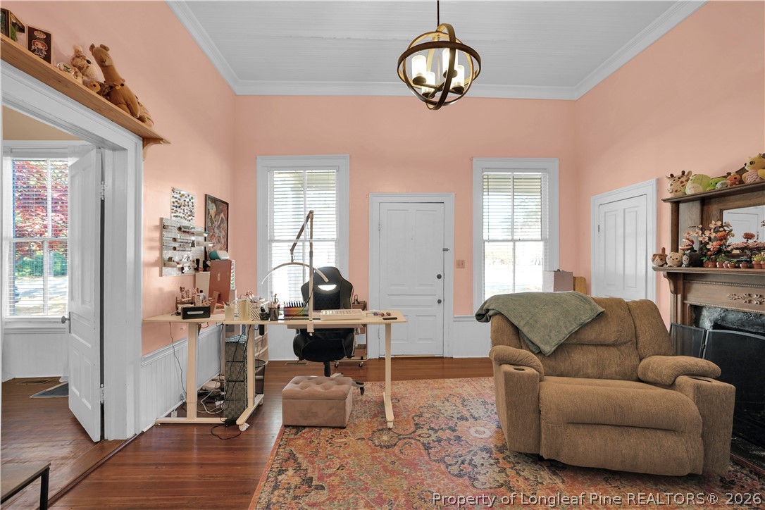 115 North Magnolia Street Raeford, NC 28376 - Photo 13 of 29 a living room with furniture a chandelier and a window