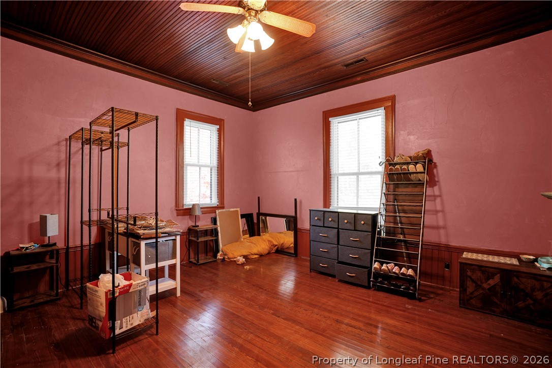 115 North Magnolia Street Raeford, NC 28376 - Photo 23 of 29 a bedroom with furniture and wooden floor