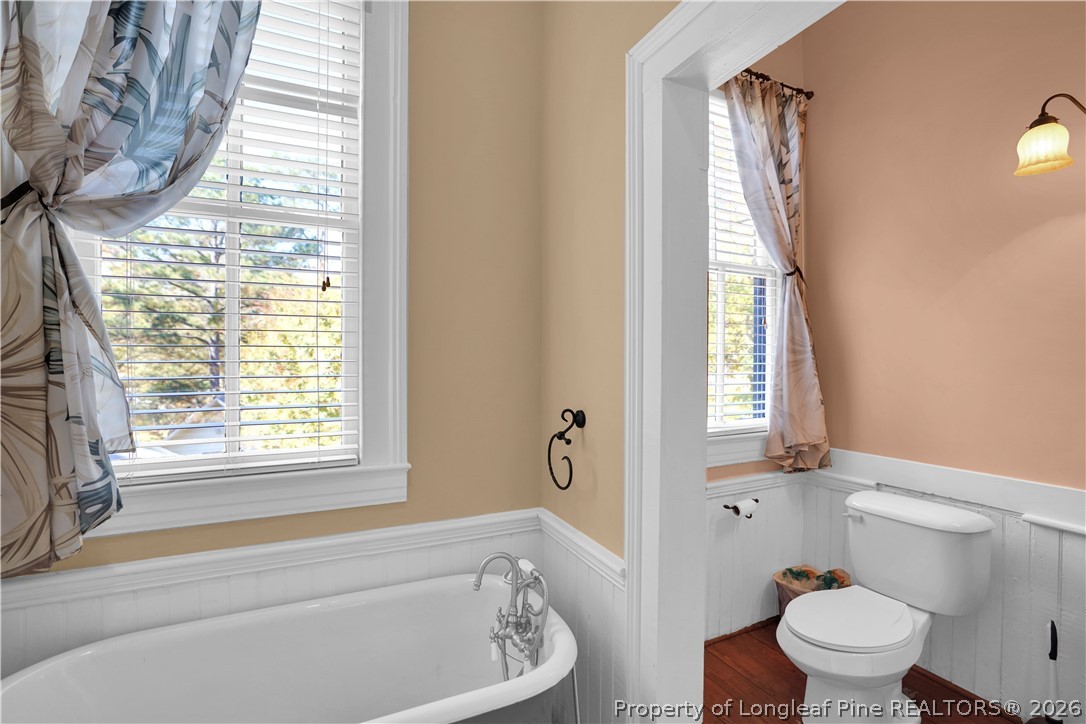 115 North Magnolia Street Raeford, NC 28376 - Photo 24 of 29 a bathroom with a toilet and a bathtub