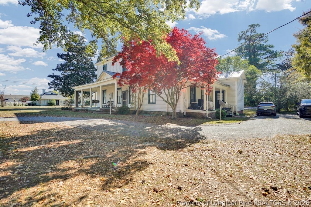 115 North Magnolia Street Raeford, NC 28376 - Photo 5 of 29 a street view with residential houses and trees
