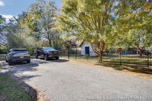 a view of a living room with furniture and a chandelier