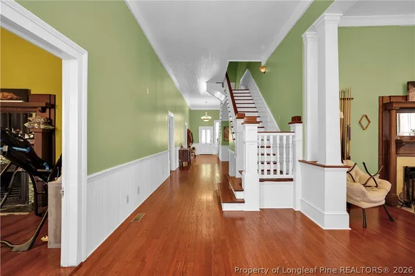 a view of entryway with wooden floor