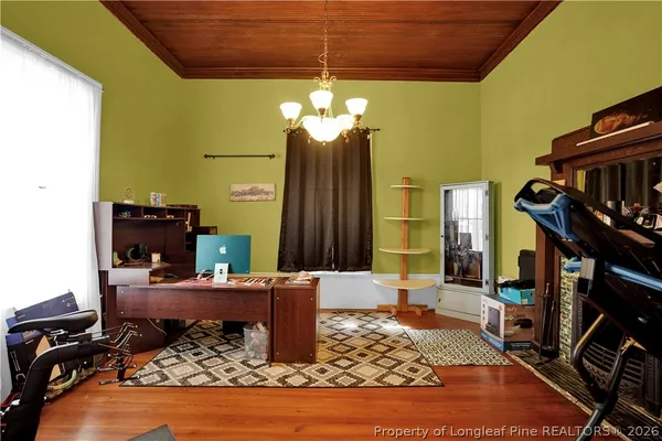 a bathroom with a granite countertop toilet sink mirror and vanity