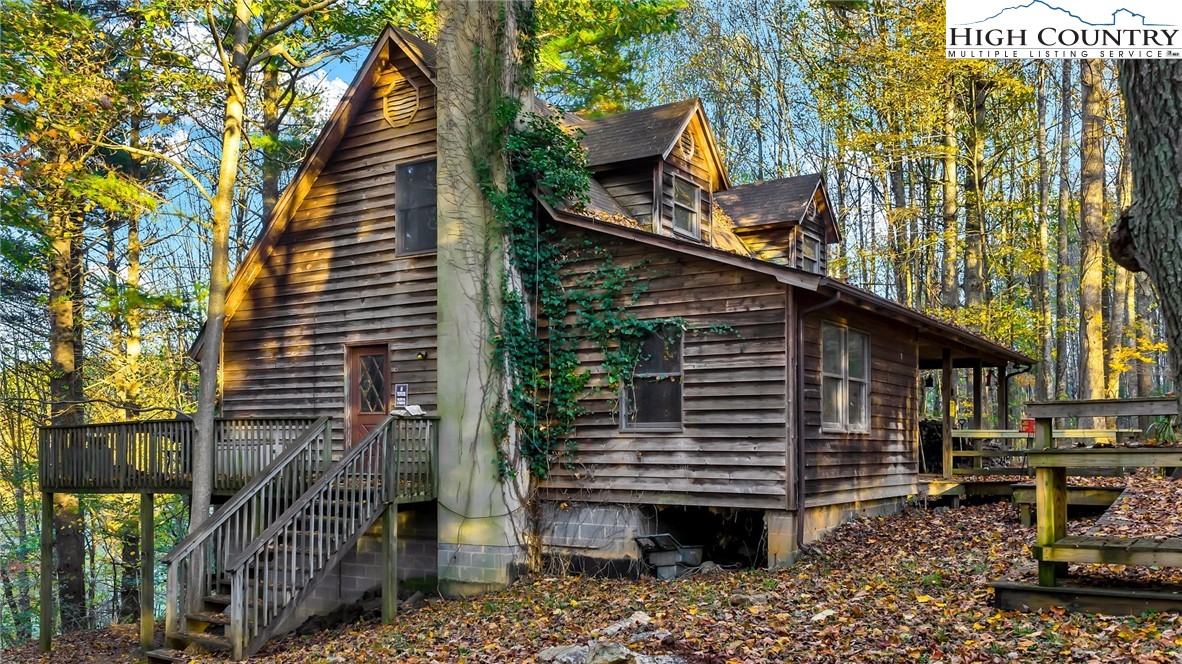 539 Four Coves Trail Crumpler, NC 28617 - Photo 2 of 37 a small hut under the tree