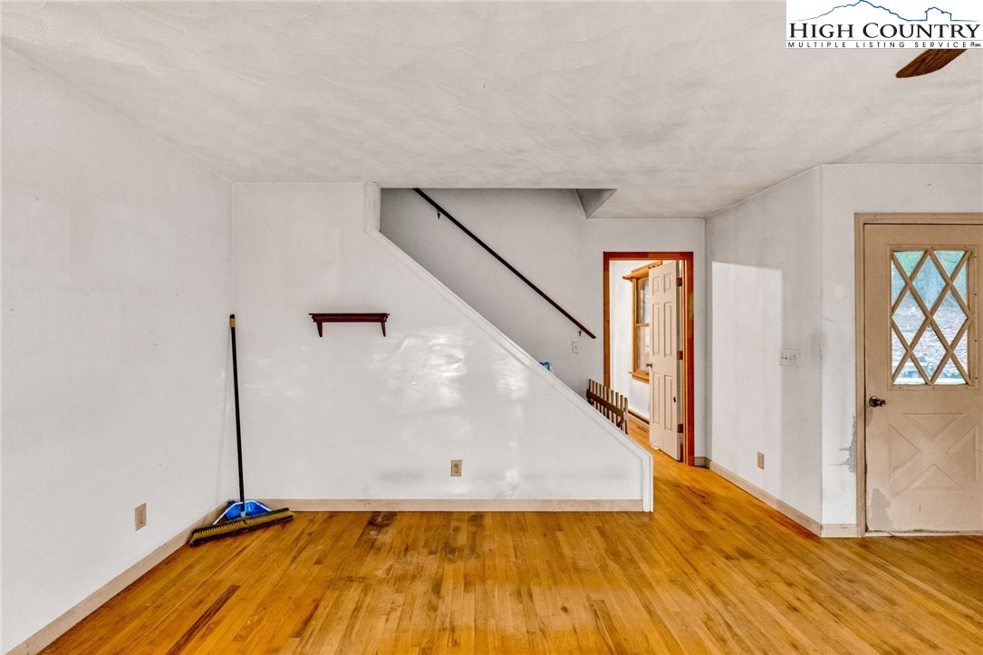 539 Four Coves Trail Crumpler, NC 28617 - Photo 24 of 37 a view of empty room with wooden floor