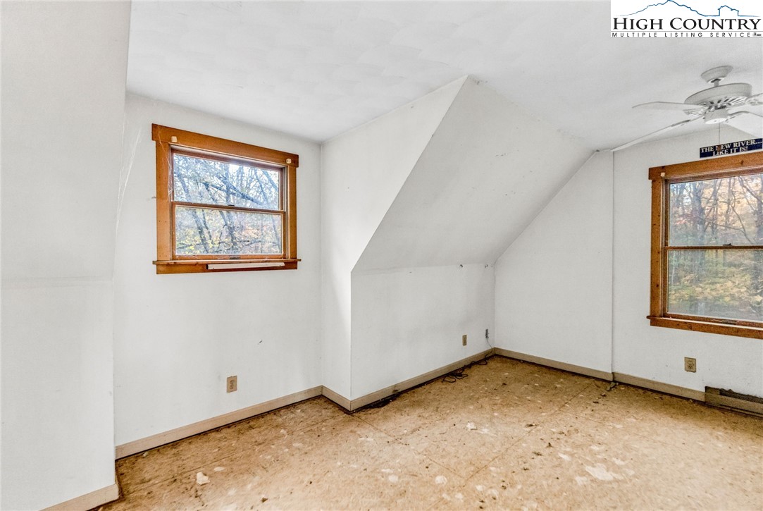 539 Four Coves Trail Crumpler, NC 28617 - Photo 26 of 37 an empty room with windows