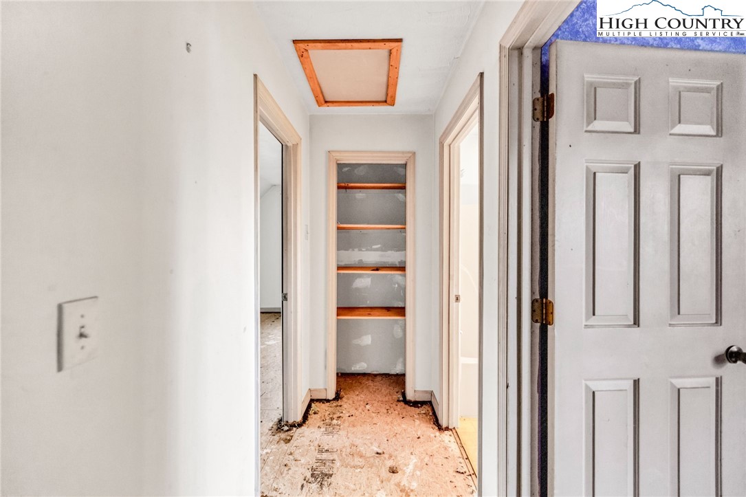 539 Four Coves Trail Crumpler, NC 28617 - Photo 28 of 37 a view of a hallway to rooms