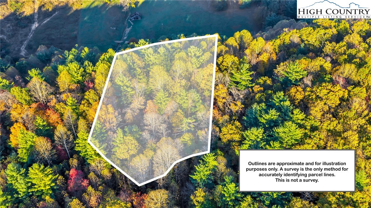 539 Four Coves Trail Crumpler, NC 28617 - Photo 3 of 37 a sign that is sitting on a wooden floor