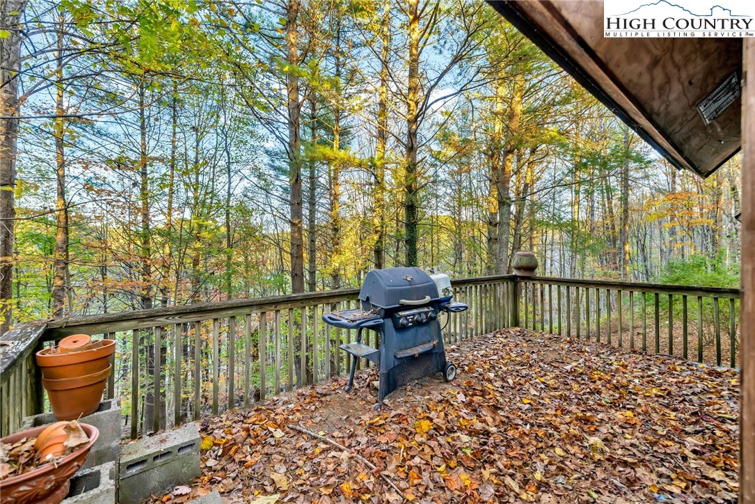 539 Four Coves Trail Crumpler, NC 28617 - Photo 34 of 37 a view of a balcony with chairs