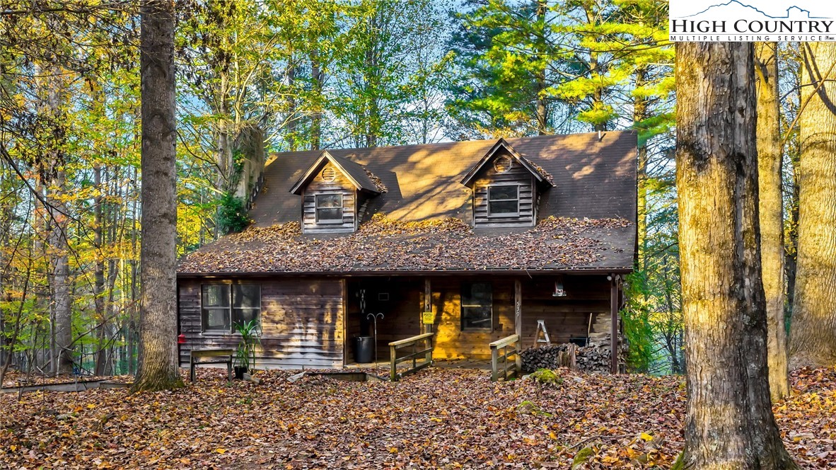 539 Four Coves Trail Crumpler, NC 28617 - Photo 5 of 37 a view of house with outdoor seating space
