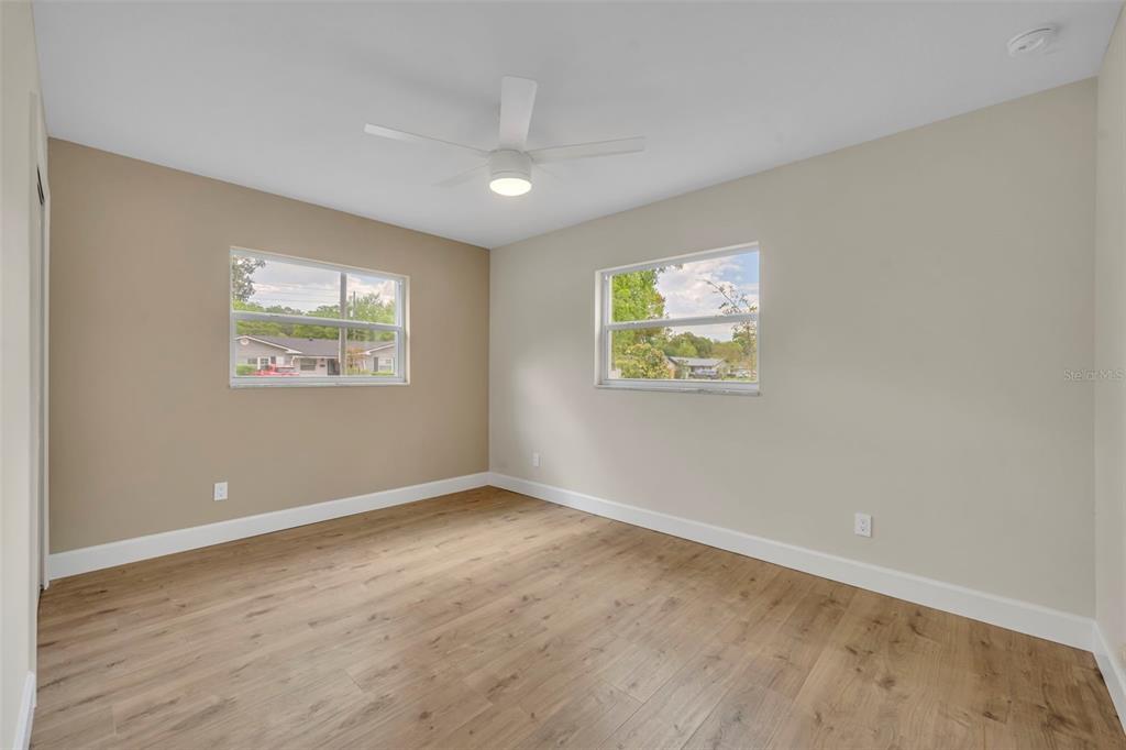350 Cornwall Road Winter Park, FL 32792 - Photo 29 of 36 a view of an empty room with a window and a bookshelf