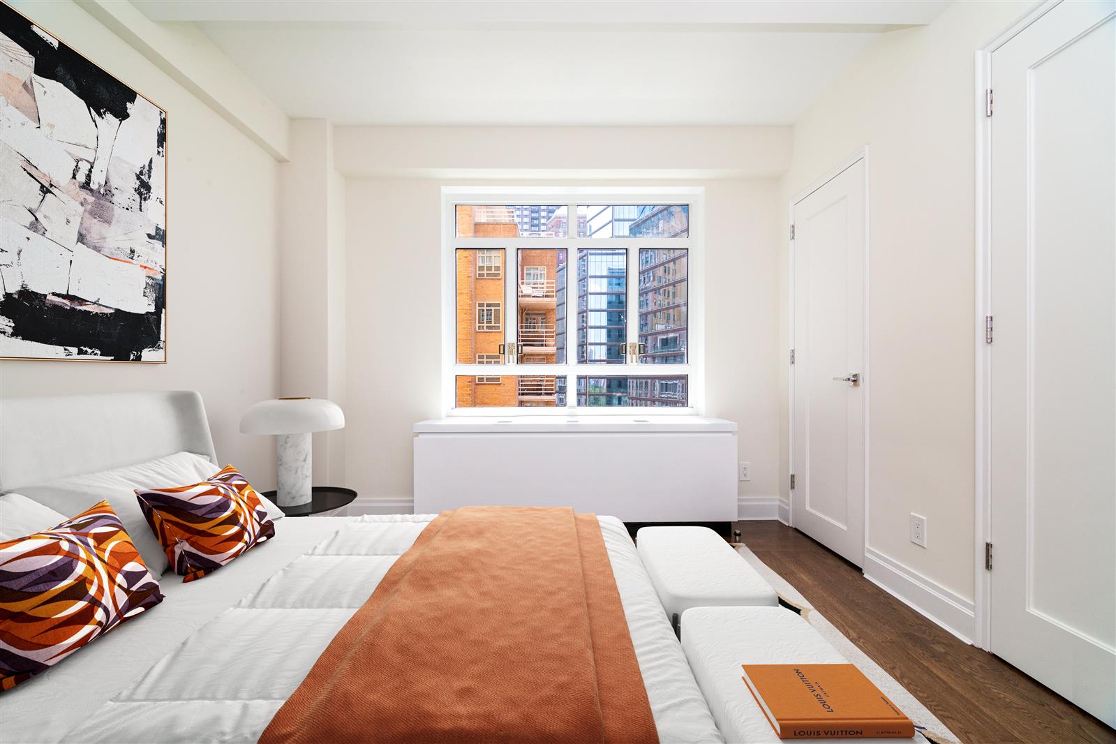 240 Central Park South, Unit 13GH Manhattan, NY 10019 - Photo 15 of 22 a bedroom with a bed and a window