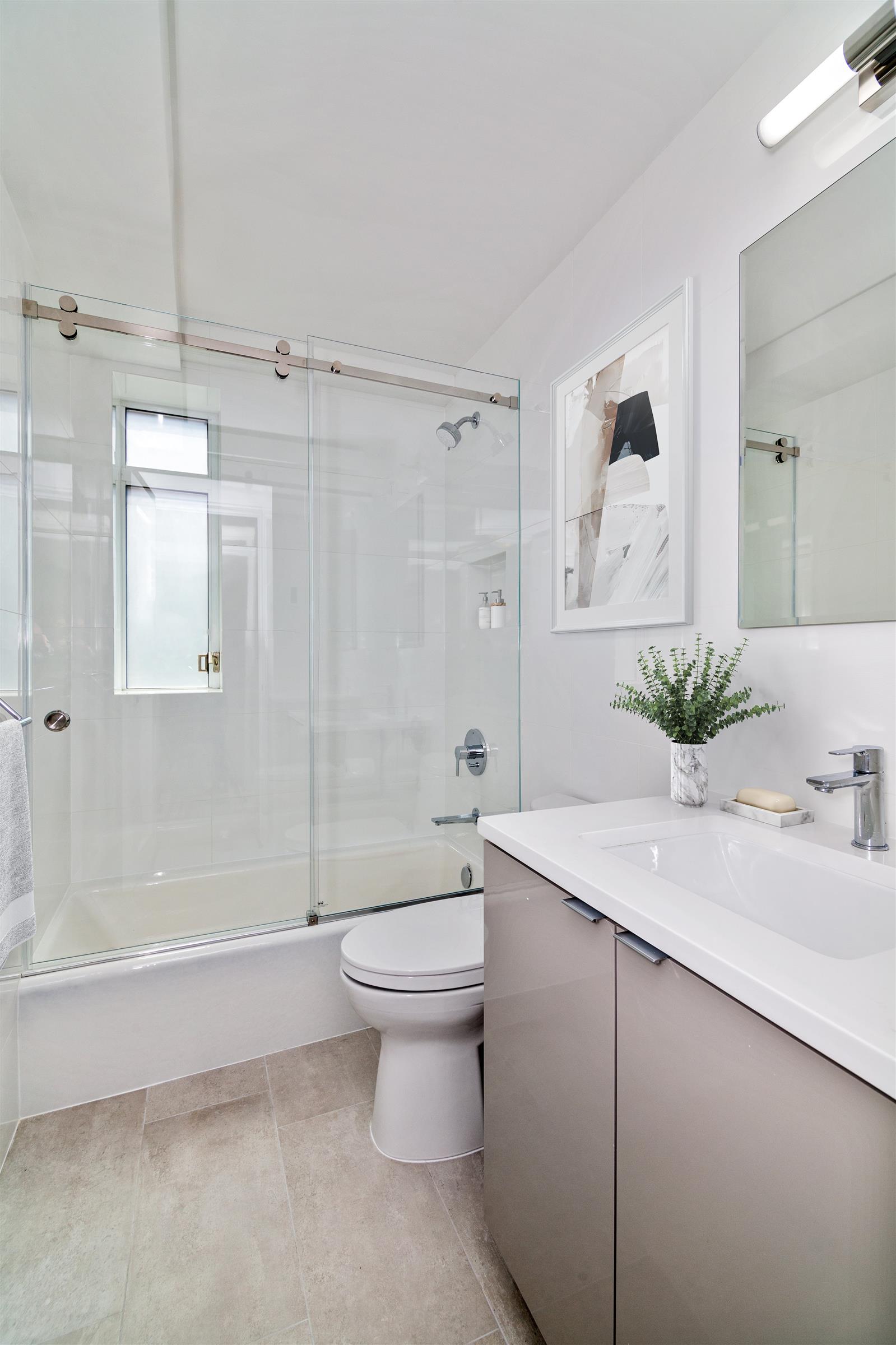 240 Central Park South, Unit 13GH Manhattan, NY 10019 - Photo 20 of 22 a bathroom with a sink a toilet and shower