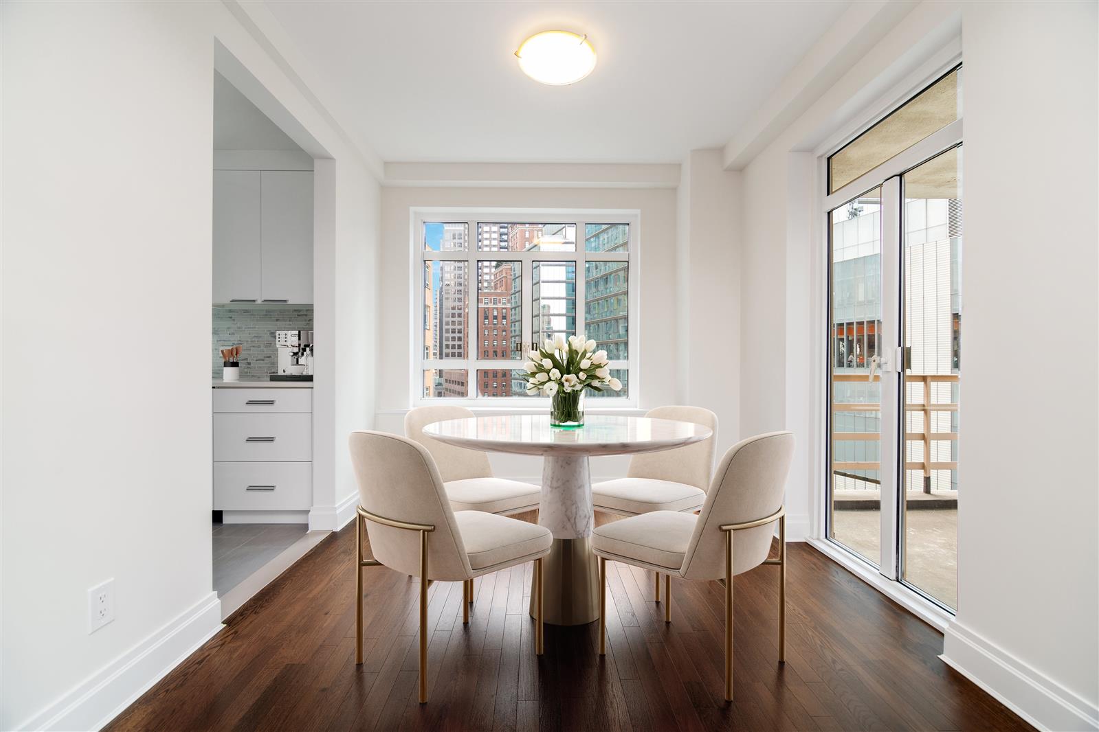 240 Central Park South, Unit 13GH Manhattan, NY 10019 - Photo 5 of 22 a view of a dining room with furniture window and wooden floor