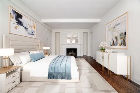 a bed room with a bed and a fireplace