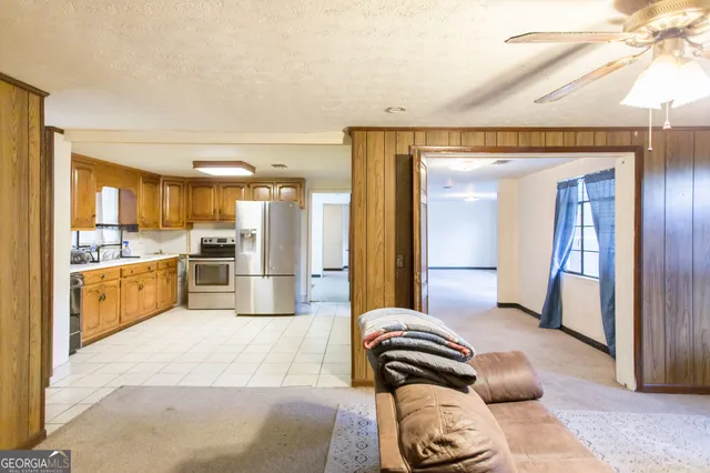 a kitchen with a refrigerator and a sink