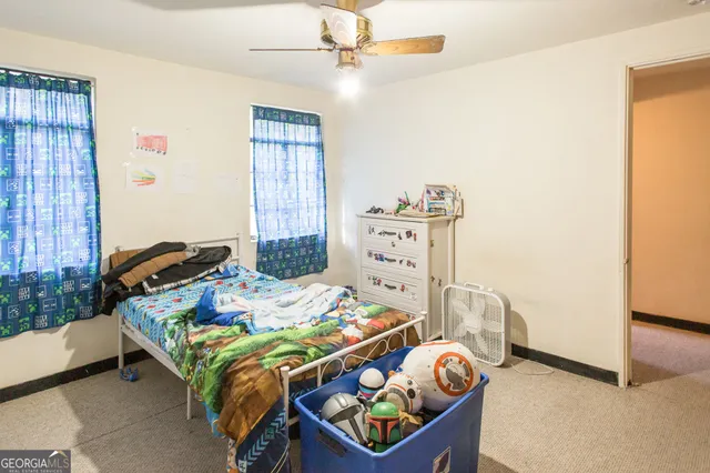 a bedroom with a bed and a table