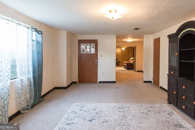 a view of livingroom with furniture and window