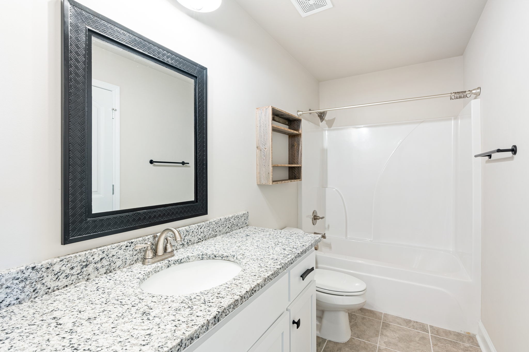 2034 Downstream Drive Ashland City, TN 37015 - Photo 11 of 23 a bathroom with a granite countertop sink toilet and shower