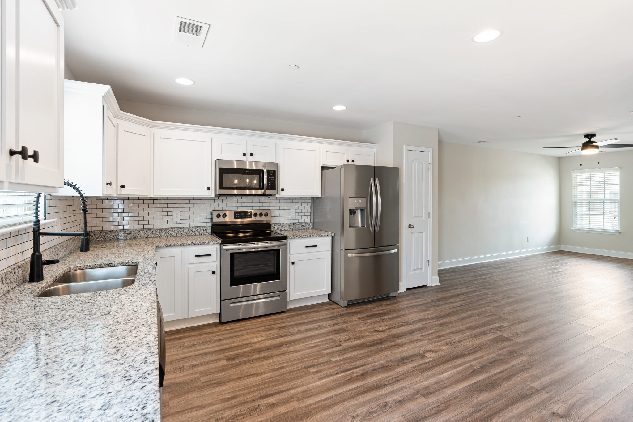 2034 Downstream Drive Ashland City, TN 37015 - Photo 16 of 23 a kitchen with granite countertop a refrigerator stove top oven and sink