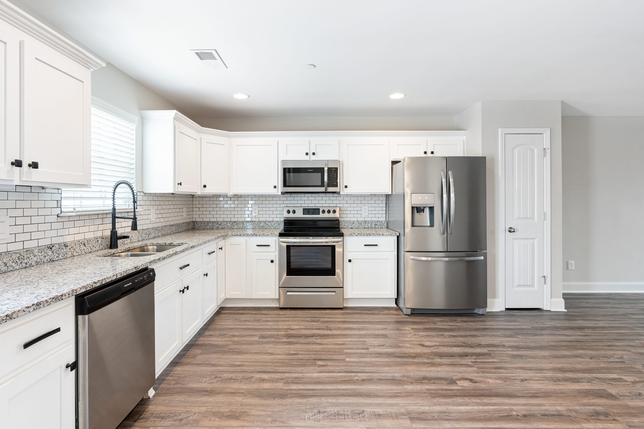2034 Downstream Drive Ashland City, TN 37015 - Photo 17 of 23 a kitchen with granite countertop a refrigerator stove and sink