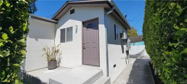 a view of a house with a potted plant