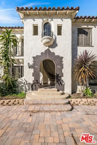 a view of a building with potted plants