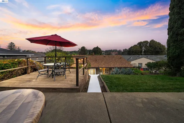 a view of a hallway with front door and wooden door