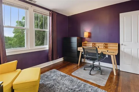 a workspace with furniture and a window