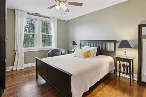 a bed room with a bed and a night stand