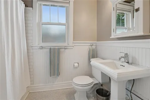 a bathroom with a sink and mirror