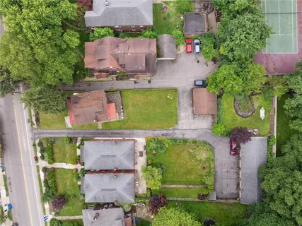 an aerial view of residential house with outdoor space and swimming pool