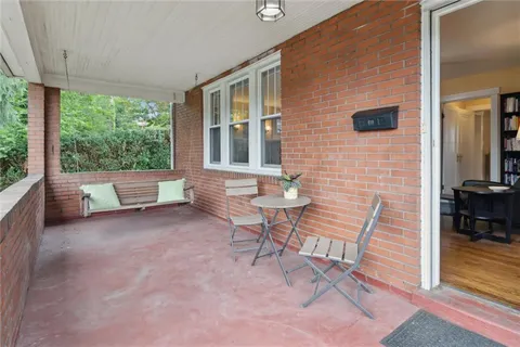 a view of a patio with a table and chairs