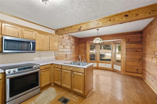 a kitchen with a stove and a microwave