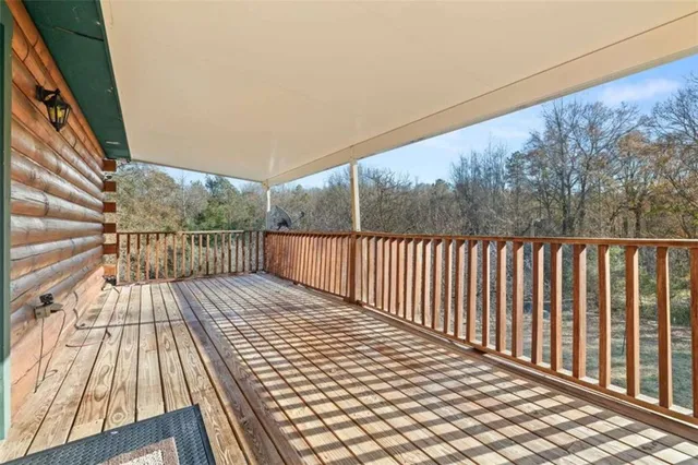 a view of wooden balcony with wooden floor
