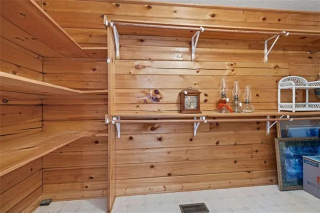 a view of a balcony with wooden floor and fence