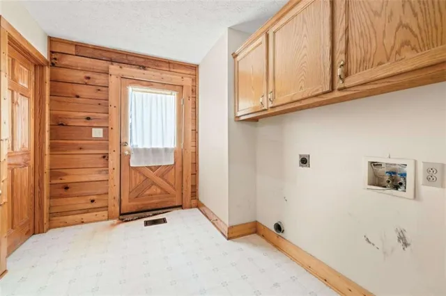 a view of a storage & utility room with a sink