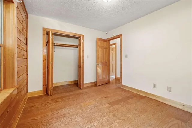 a view of an empty room and a window