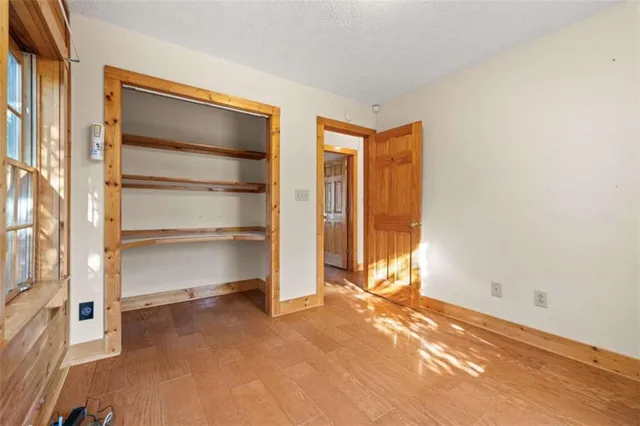 a view of an empty room with stairs