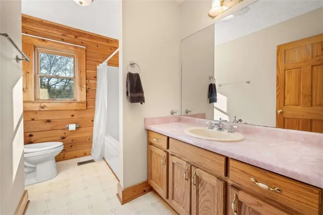 a view of a room with a wooden ceiling