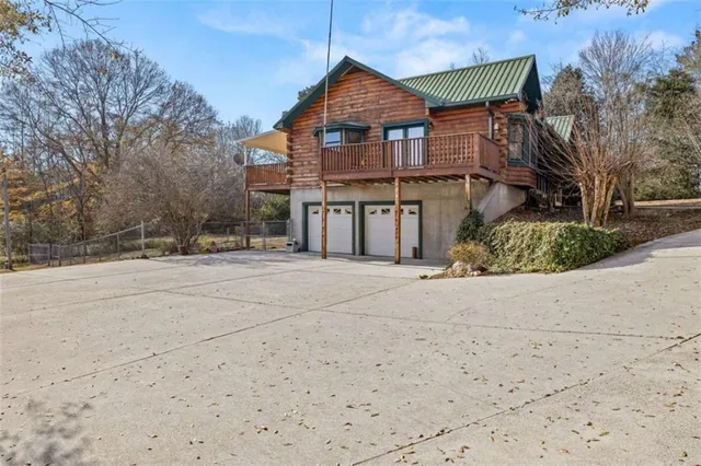a view of dirt yard with a large tree