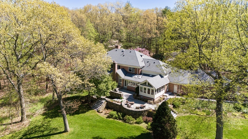 24 Wheeler Road Lincoln, MA 01773 - Photo 1 of 32 aerial view of a house with a yard
