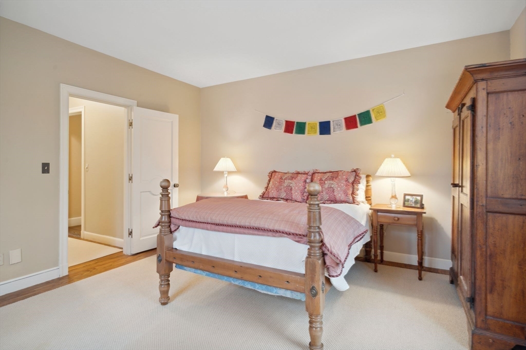 24 Wheeler Road Lincoln, MA 01773 - Photo 13 of 32 a bedroom with a bed and a refrigerator