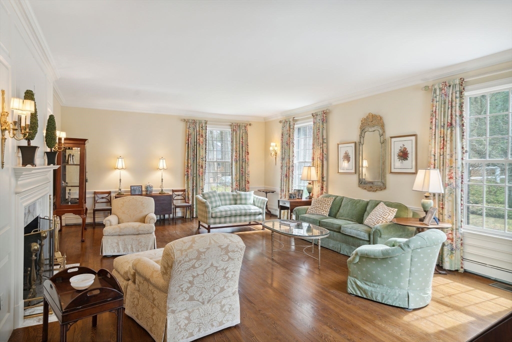24 Wheeler Road Lincoln, MA 01773 - Photo 14 of 32 a living room with fireplace furniture and floor to ceiling windows