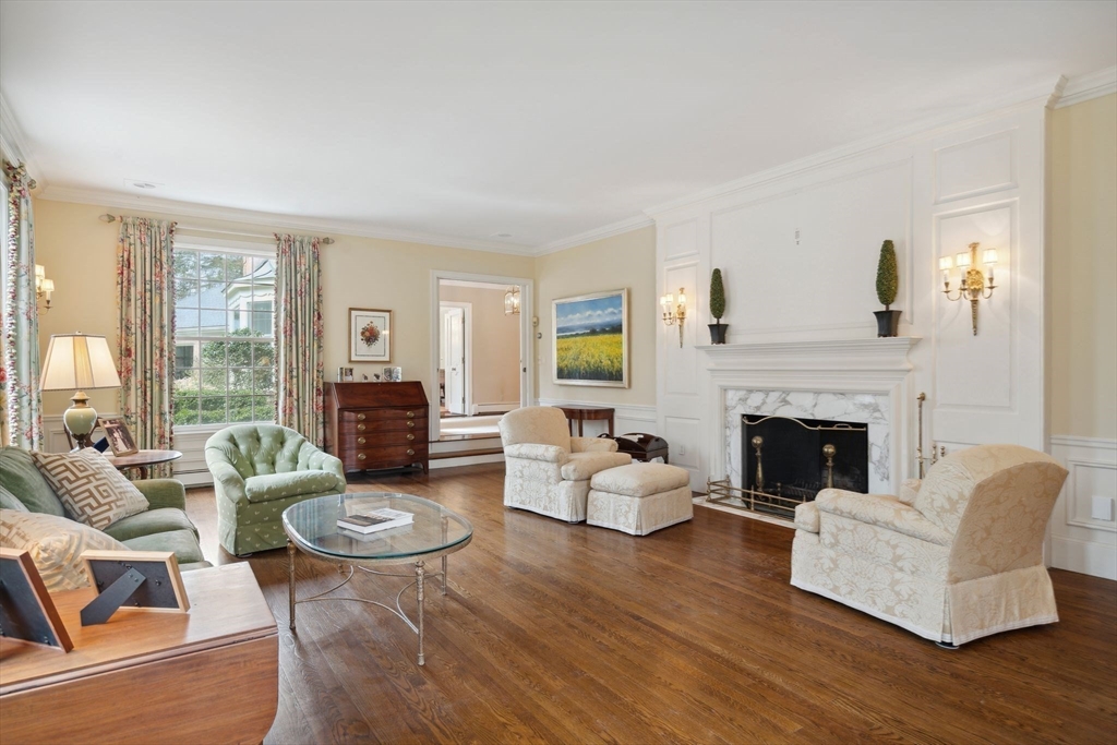 24 Wheeler Road Lincoln, MA 01773 - Photo 15 of 32 a living room with furniture and a fireplace