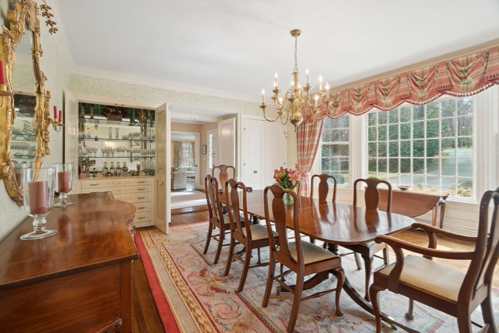 24 Wheeler Road Lincoln, MA 01773 - Photo 16 of 32 a view of a dining room with furniture wooden floor and chandelier