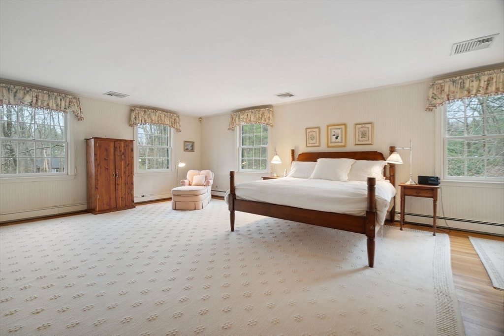 24 Wheeler Road Lincoln, MA 01773 - Photo 20 of 32 a bedroom with a bed and a large window