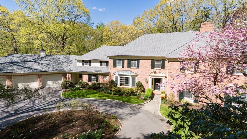 24 Wheeler Road Lincoln, MA 01773 - Photo 2 of 32 a aerial view of a house with plants and large trees